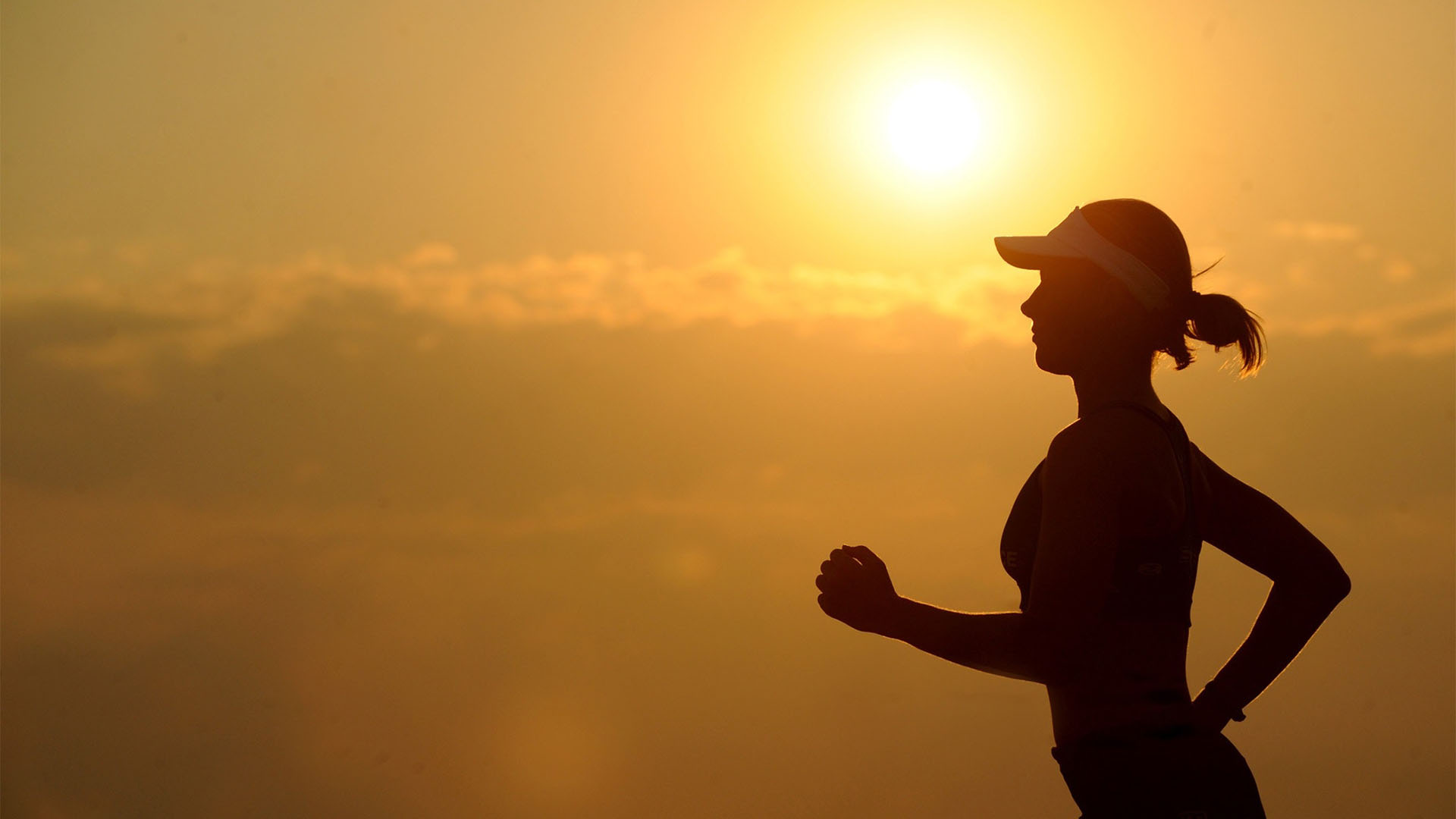 A women running outdoor in the sunset