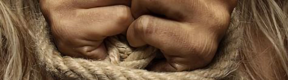 A person's hands being tied together with rope.